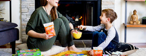 mother and child enjoying family game night with yumearth organic candy