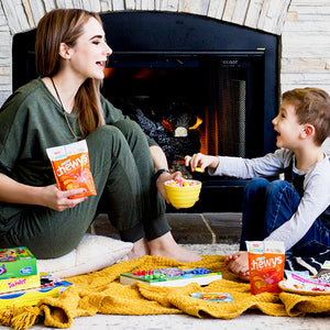 mother and child enjoying family game night with yumearth organic candy