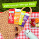 Picnic scene with YumEarth snack 2oz on the go bag sizes: Giggles, Chewys, Gummy Bears, and Fruit Snacks