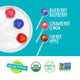 YumEarth fruit snack shapes on blue background with flavors: blueberry raspberry, strawberry lemon, cherry apple.