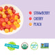Bowl of YumEarth jelly bean‑style snacks and flavor list: strawberry, banana, cherry, peach.