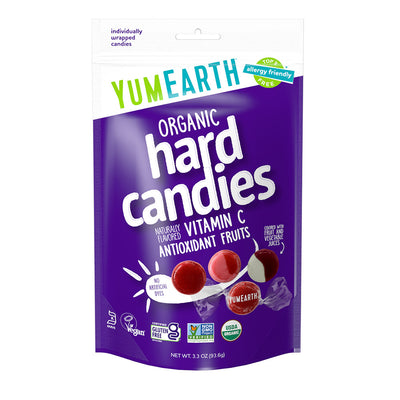 Resealable pouch of YumEarth hard candies in purple packaging with flavor indication and labeled free from artificial dyes and allergy‑friendly.